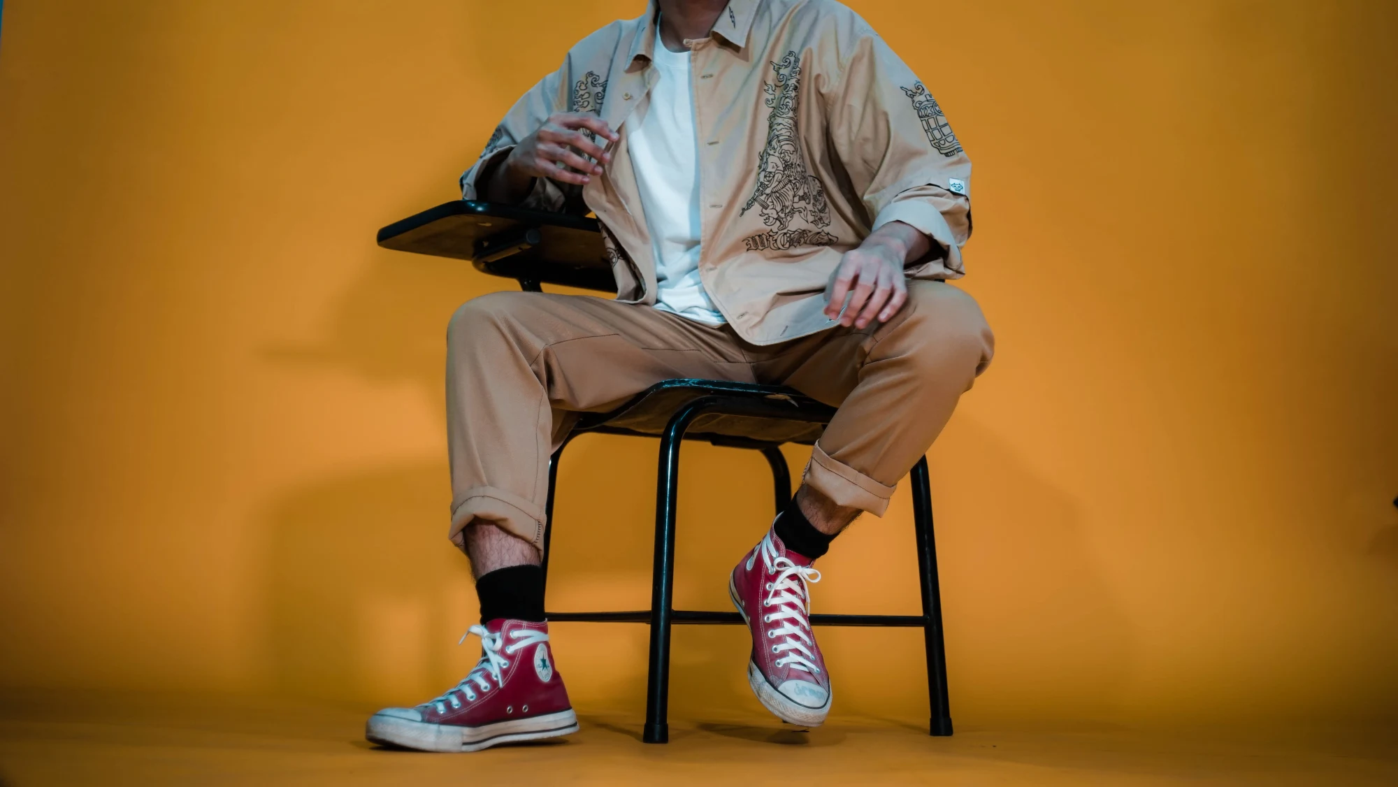 Red Converse on yellow